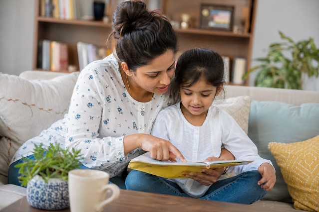 Child reading with mother (avoid using mobile screens).png Child reading with mother (avoid using mobile screens).png